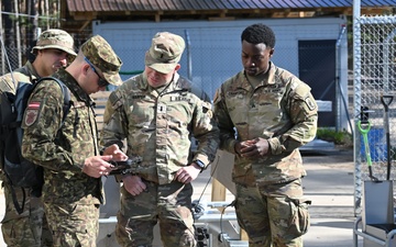 Swift Response 25: Latvian National Armed Forces show Sky Soldiers How To Operate Target Lifters