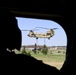 Soldier Observes CH-47 Chinook Lift HMMWV