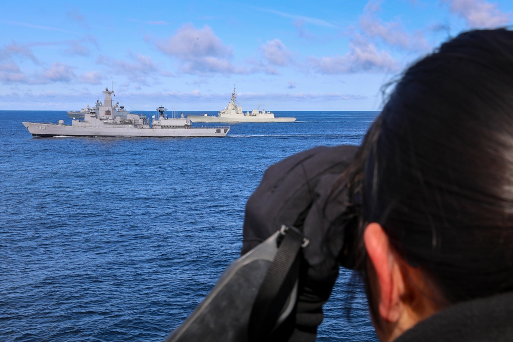 Ensign Marisa Ostrowsky uses a laser range finder while participating in maneuvering drills