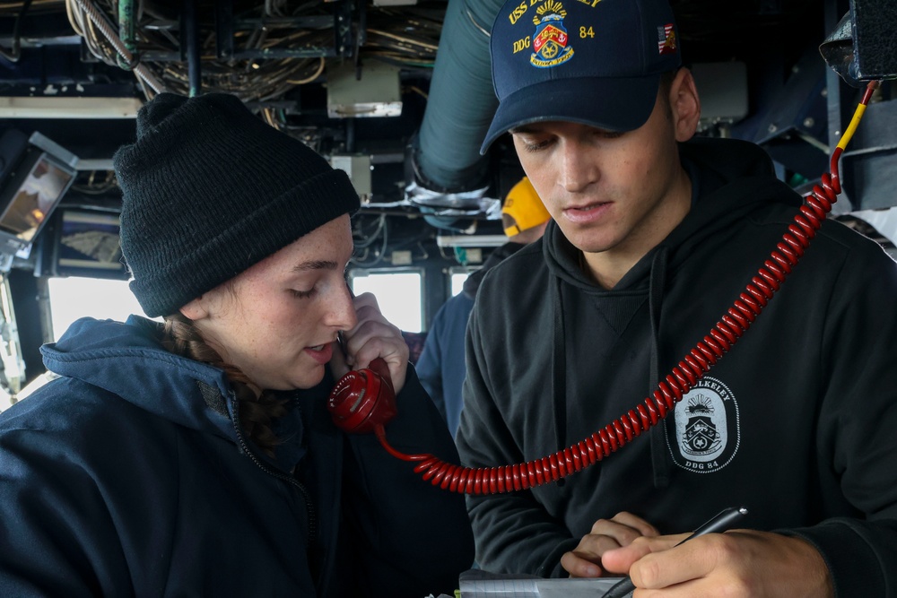 Midshipman Kimberly Owens-Asaro and and Ensign Luca Greenspun conduct tactical communications