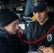 Midshipman Kimberly Owens-Asaro and and Ensign Luca Greenspun conduct tactical communications