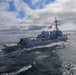 The Arleigh Burke-class guided-missile destroyer USS Thomas Hudner (DDG 116) sails alongside the USS Bulkeley (DDG 84)