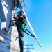 Aviation Machinist’s Mate 2nd Class Keith Gonzales  installs a tail rotor blade cover on a MH-60R Sea Hawk helicopter