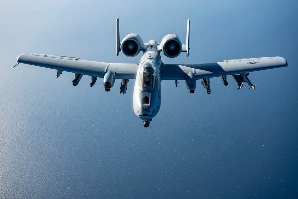 Stratotanker Refuels Thunderbolt in the Night Sky