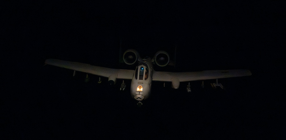 Stratotanker Refuels Thunderbolt in the Night Sky