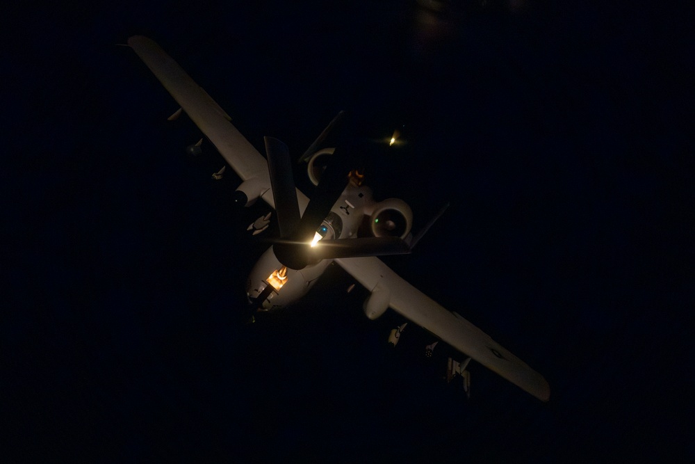 Stratotanker Refuels Thunderbolt in the Night Sky