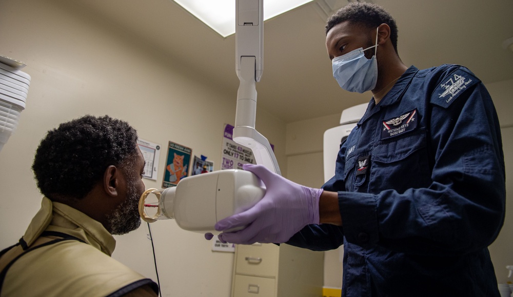 USS John C. Stennis (CVN 74) Sailor receives dental work