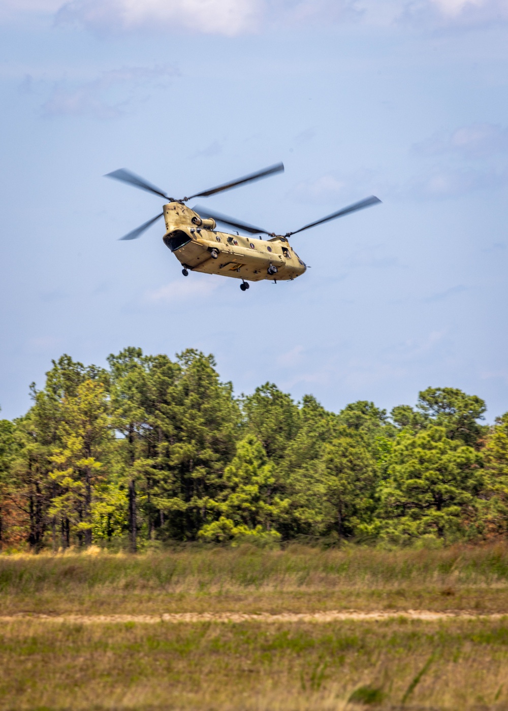 Soldiers from 82nd Airborne Division jump from a CH-47 Chinook to earn their foreign wings