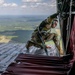 Soldiers from 82nd Airborne Division jump from a CH-47 Chinook to earn their foreign wings