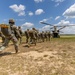 Soldiers from 82nd Airborne Division jump from a CH-47 Chinook to earn their foreign wings