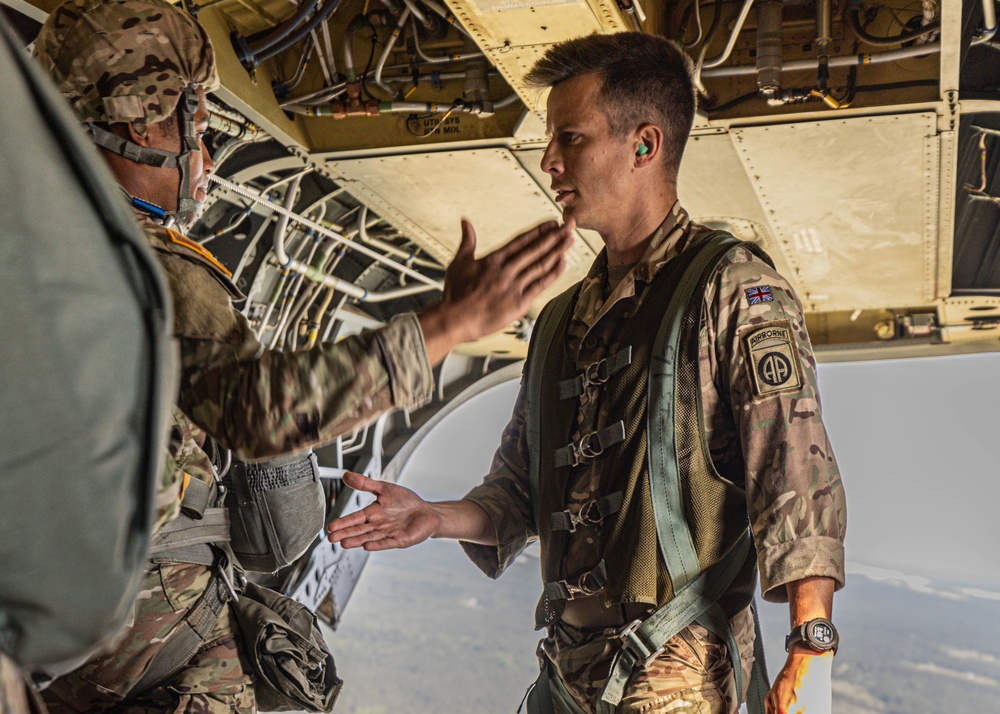 Soldiers from 82nd Airborne Division jump from a CH-47 Chinook to earn their foreign wings