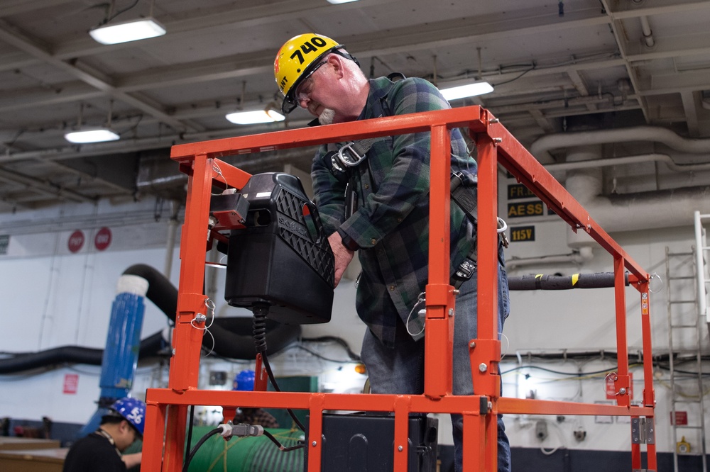 USS Ronald Reagan (CVN 76) Sailors, Puget Sound Naval Shipyard (PSNS) workers, and contractors conduct routine operations and ship maintenance