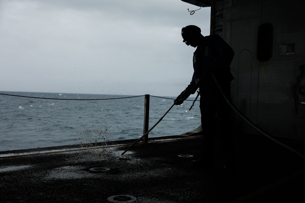 Aviation Boatswain's Mate Maintains Iwo Jima Hangar Bay Underway