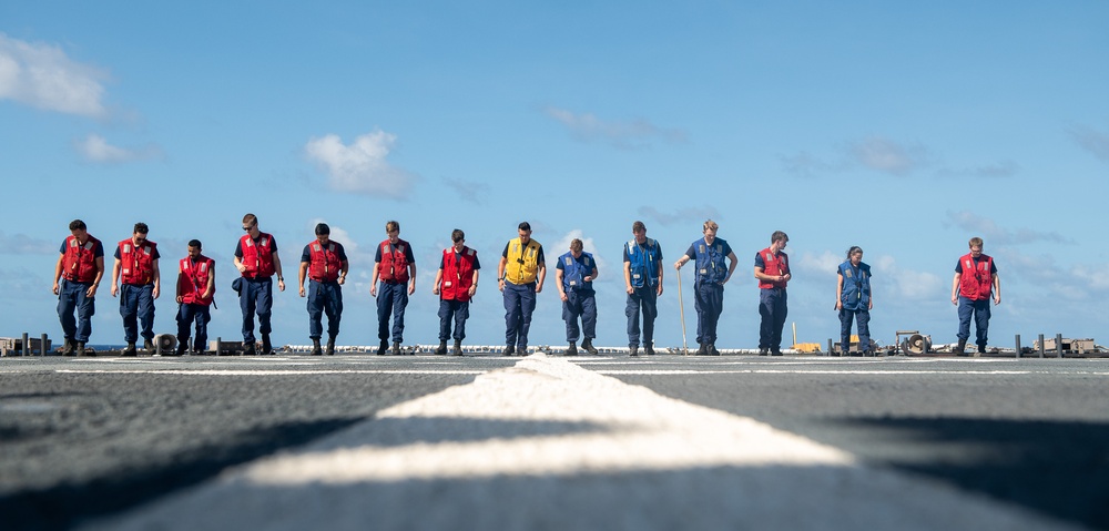 U.S. Coast Guard Cutter Stratton crew train with a Navy MH-60R Seahawk helicopter crew from Andersen Air Force Base on the Pacific Ocean near Guam