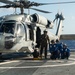 U.S. Coast Guard Cutter Stratton crew train with a Navy MH-60R Seahawk helicopter crew from Andersen Air Force Base on the Pacific Ocean near Guam