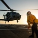 U.S. Coast Guard Cutter Stratton crew train with a Navy MH-60R Seahawk helicopter crew from Andersen Air Force Base on the Pacific Ocean near Guam