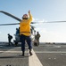 U.S. Coast Guard Cutter Stratton crew train with a Navy MH-60R Seahawk helicopter crew from Andersen Air Force Base on the Pacific Ocean near Guam