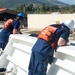 U.S. Coast Guard Cutter Stratton crew moor the Stratton at U.S. Coast Guard Forces Micronesia Sector Guam