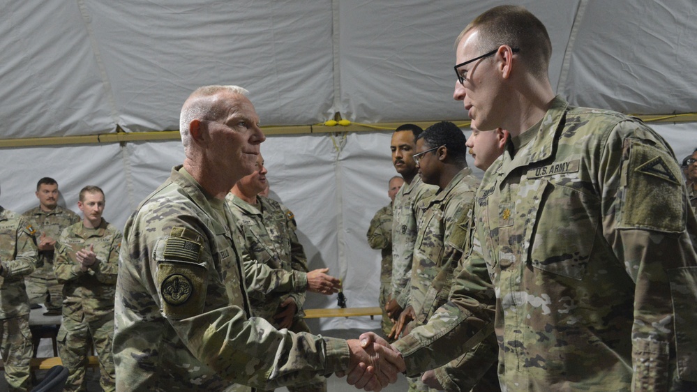 56th SBCT presents coins to GTA range operations