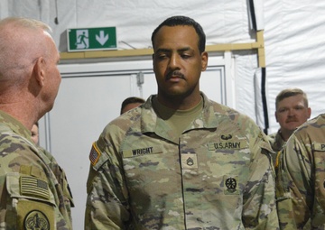 56th SBCT presents coins to GTA range operations