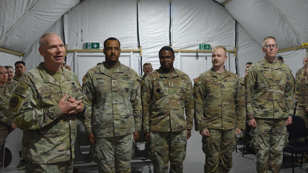 56th SBCT presents coins to GTA range operations