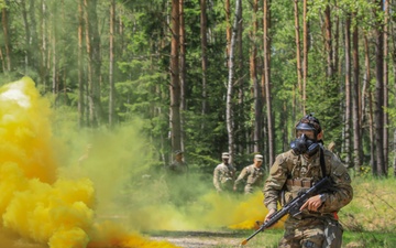 Competitors participate in CBRN Lane during V Corps Best Squad Competition