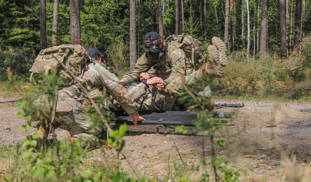 Competitors participate in CBRN Lane during V Corps Best Squad Competition