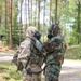 Competitors participate in CBRN Lane during V Corps Best Squad Competition