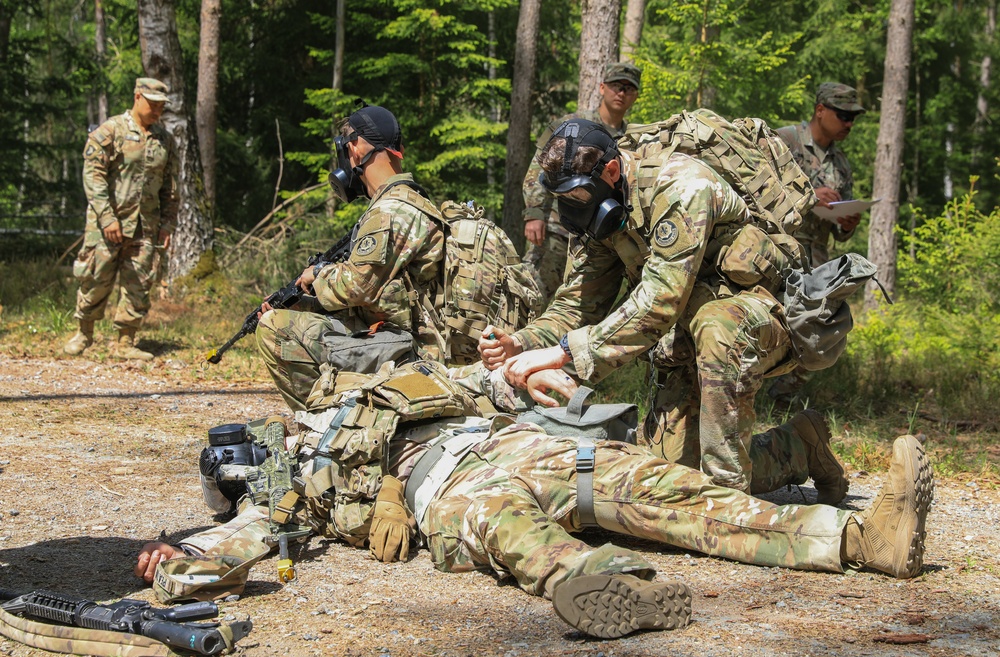 Competitors participate in CBRN Lane during V Corps Best Squad Competition
