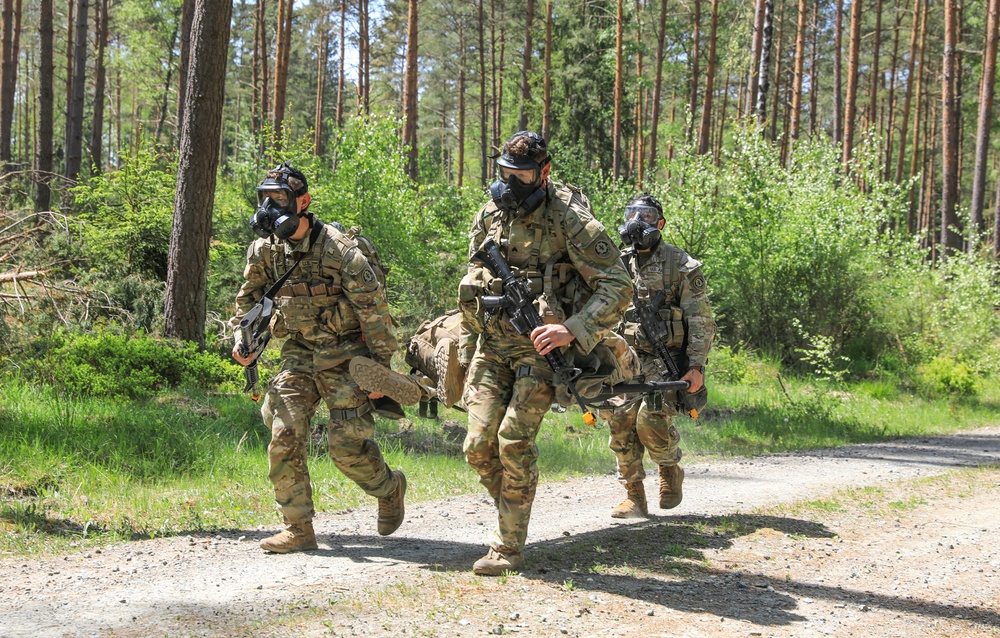 Competitors participate in CBRN Lane during V Corps Best Squad Competition