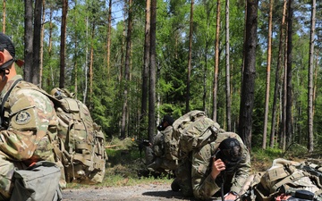 Competitors participate in CBRN Lane during V Corps Best Squad Competition