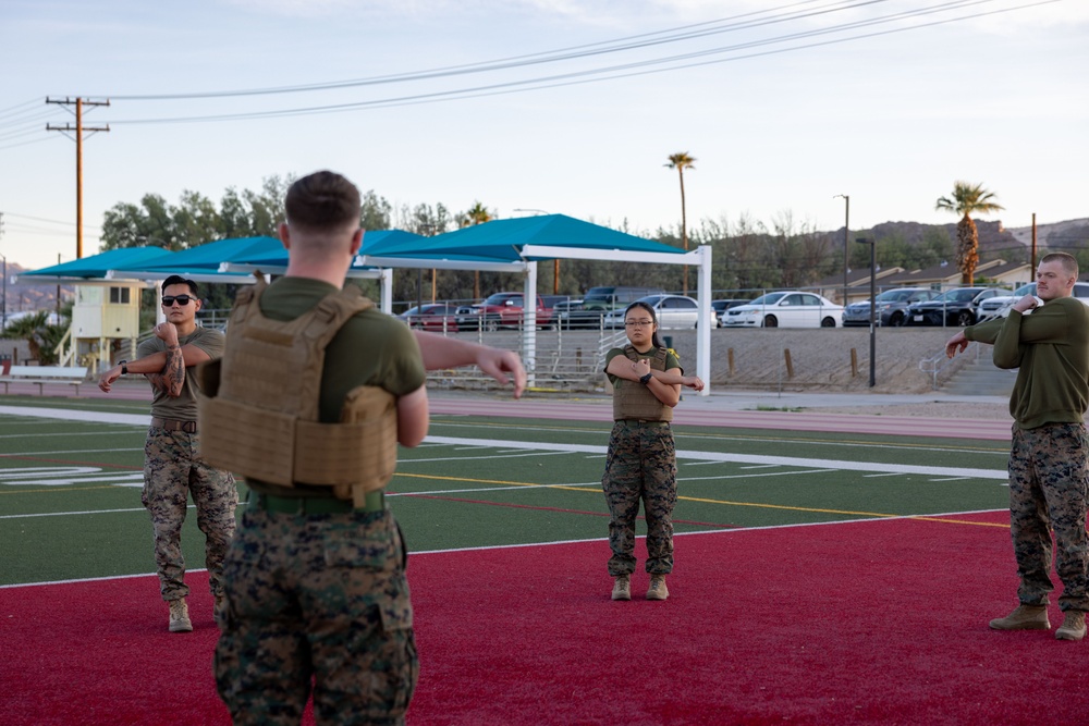 The Combat Center COMMSTRAT conducts PT in honor of LCpl Hug and Cpl Medina