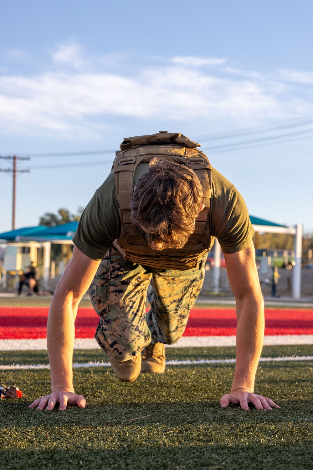 The Combat Center COMMSTRAT conducts PT in honor of LCpl Hug and Cpl Medina