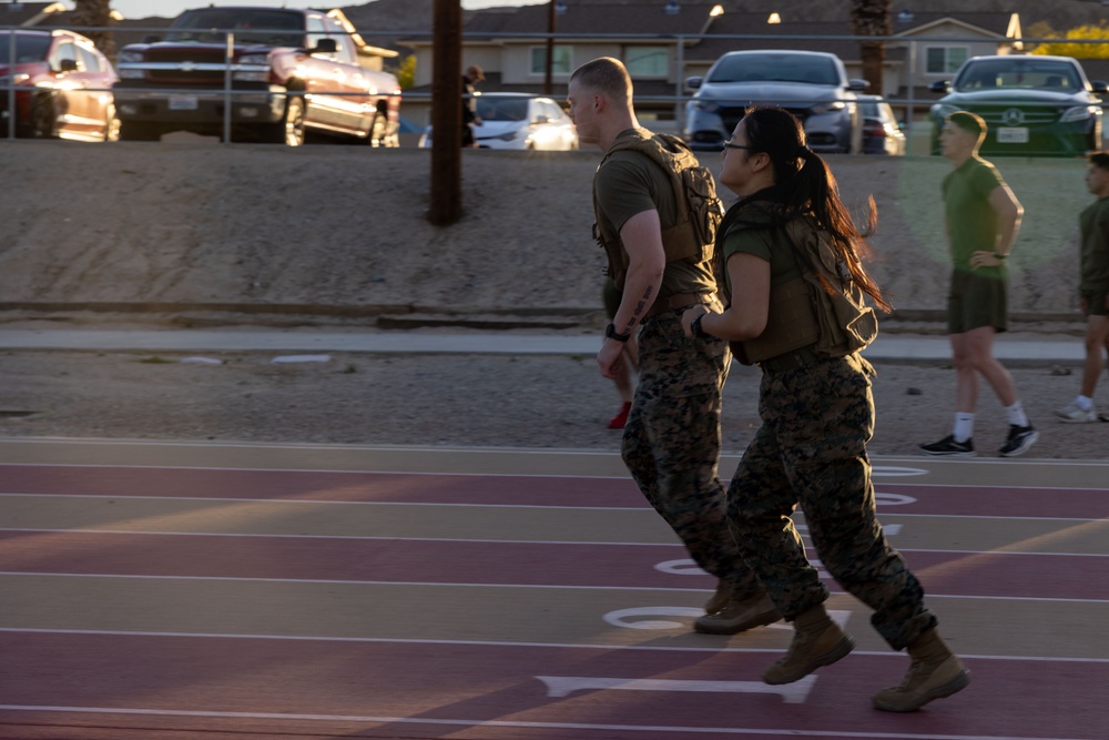 The Combat Center COMMSTRAT conducts PT in honor of LCpl Hug and Cpl Medina