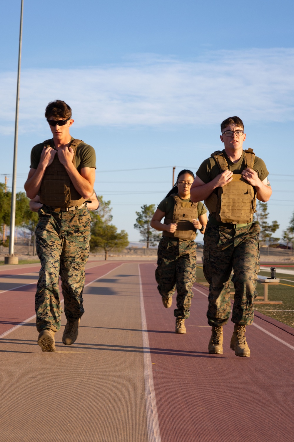 The Combat Center COMMSTRAT conducts PT in honor of LCpl Hug and Cpl Medina