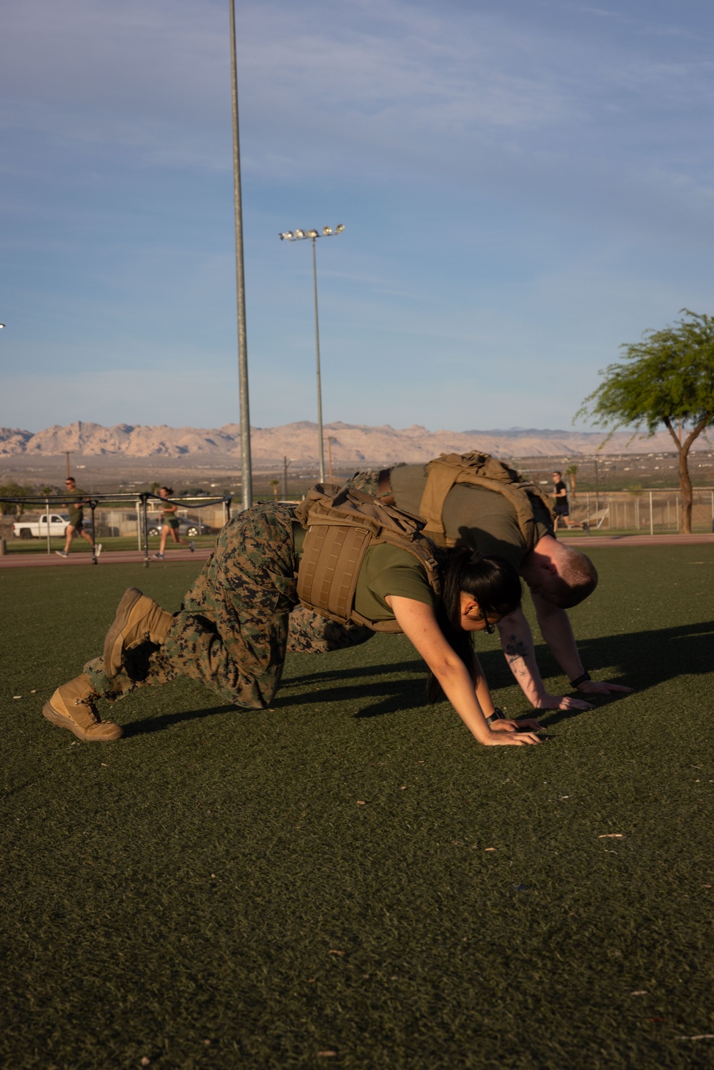 The Combat Center COMMSTRAT conducts PT in honor of LCpl Hug and Cpl Medina