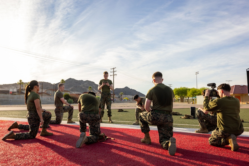 The Combat Center COMMSTRAT conducts PT in honor of LCpl Hug and Cpl Medina