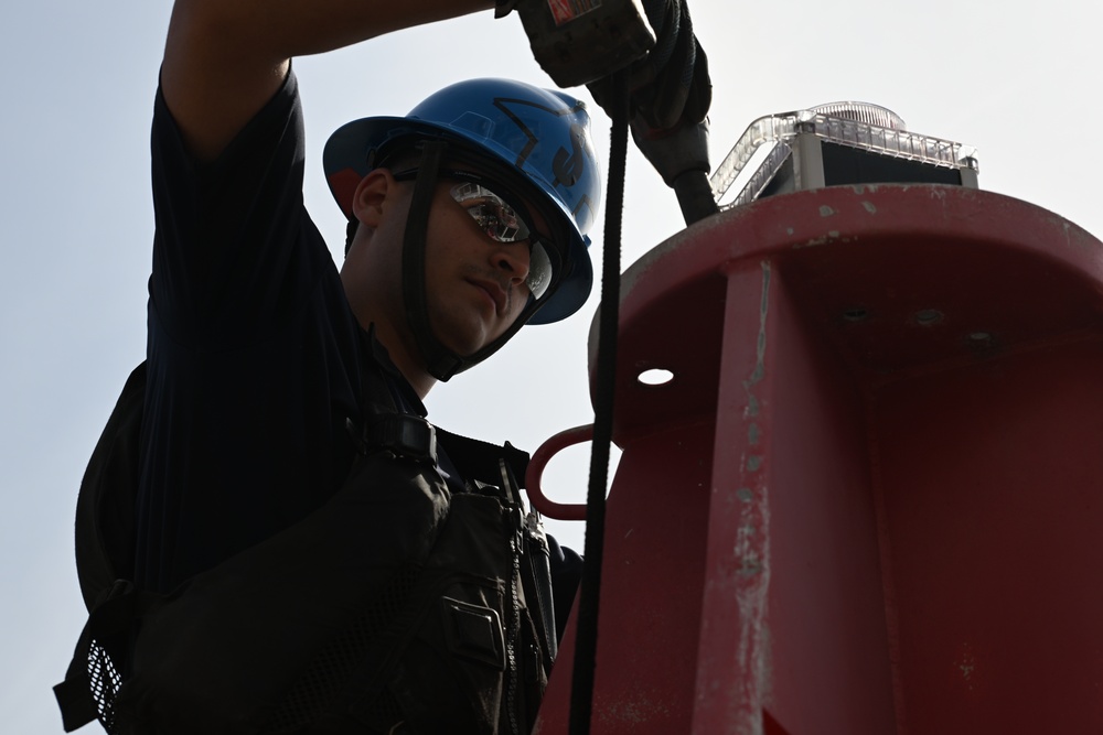 Coast Guard Cutter Frank Drew services buoys in Portsmouth, Virginia
