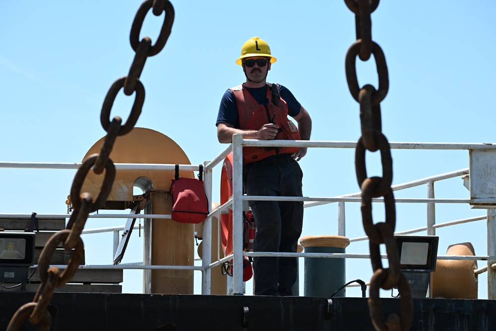 Coast Guard Cutter Frank Drew services buoys in Portsmouth, Virginia