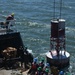 Coast Guard Cutter Frank Drew services buoys in Portsmouth, Virginia
