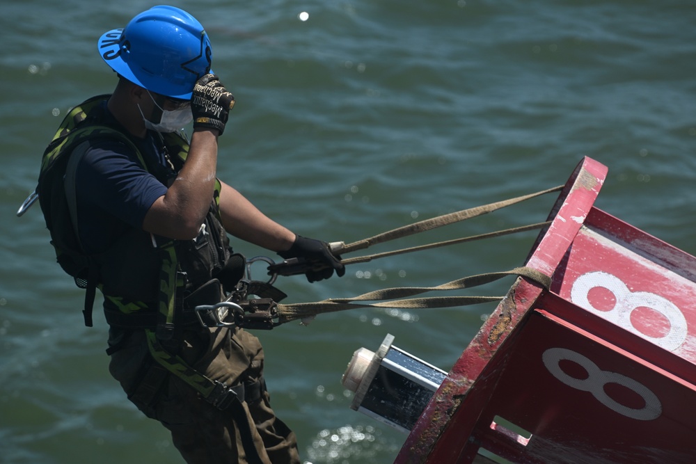 Coast Guard Cutter Frank Drew services buoys in Portsmouth, Virginia