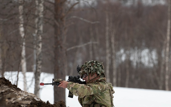 A Paratrooper from the 82nd Airborne Division pulls security from behind cover during Swift Response