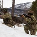 A Paratrooper from the 2nd Battalion, 505th Parachute Infantry Regiment, 3rd Brigade Combat Team, 82nd Airborne Division, lays down cover fire while his teammate reloads his weapon, May 15, 2025 in Setermoen, Norway.