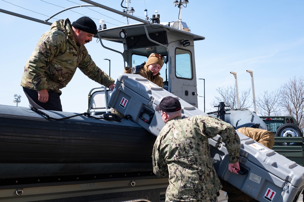 Sailors handle remotely operated vehicle.