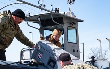 Sailors handle remotely operated vehicle.