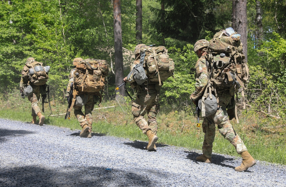 Competitors complete ruck march during V Corps Best Squad Competition