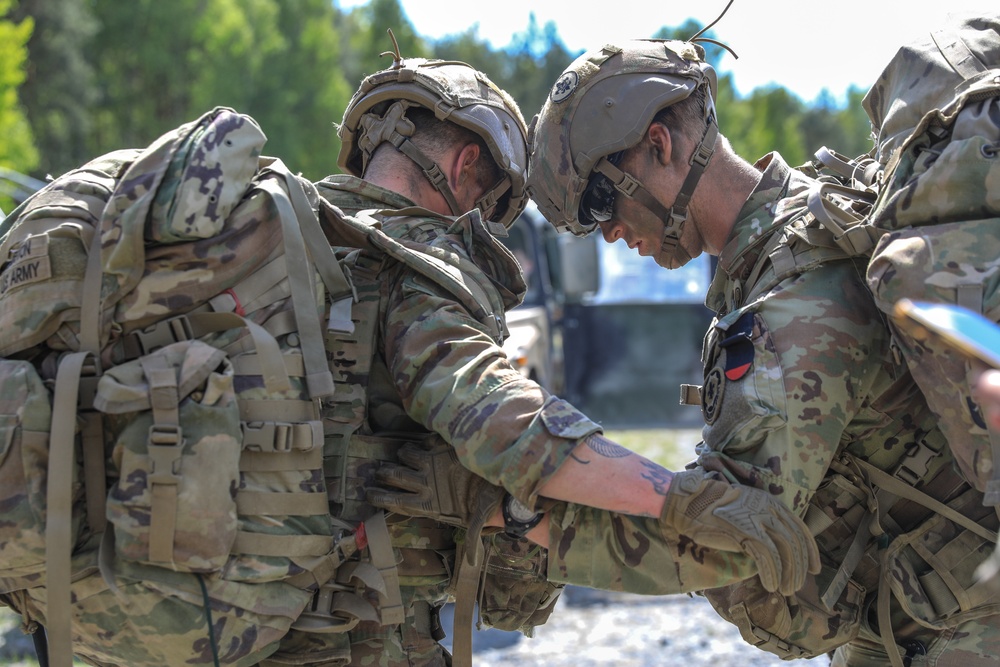 Competitors complete ruck march during V Corps Best Squad Competition