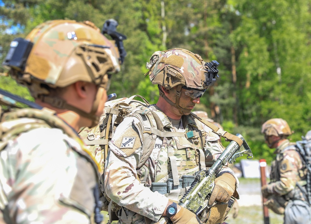 Competitors complete ruck march during V Corps Best Squad Competition