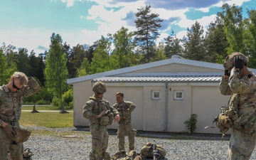 Competitors complete ruck march during V Corps Best Squad Competition