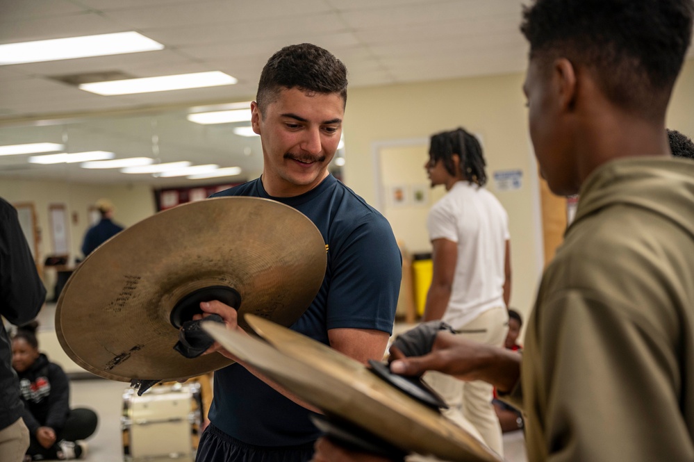 Stick Masters teach Sailors to play percussion instruments